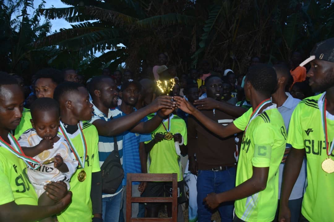 Participants holding a trophy