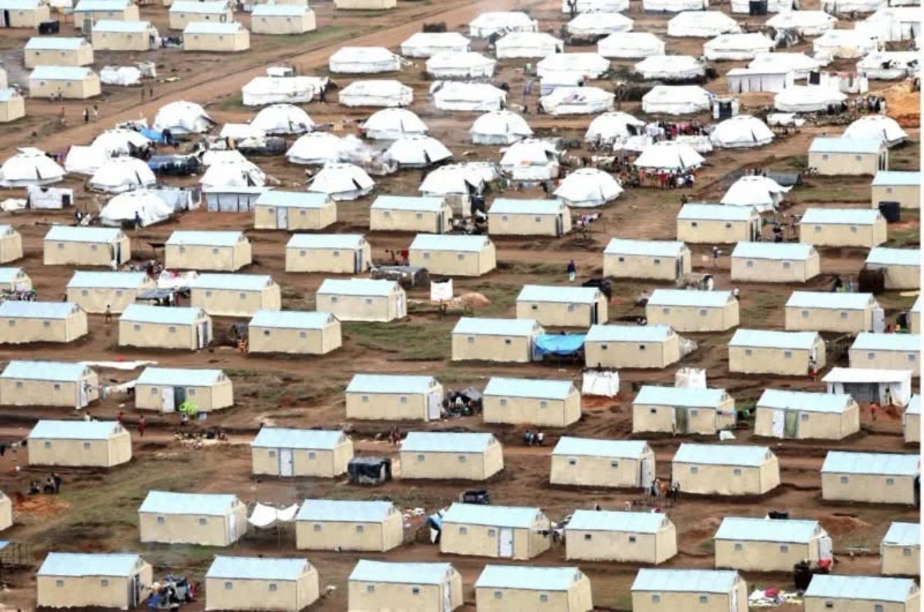 A refugee camp with shelters and temporary homes for displaced families 1